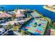 Aerial view of the many pickle ball courts, clubhouse, and pool in this community at 15657 Aurora Lake Cir, Wimauma, FL 33598
