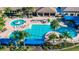 Resort-style pool with plenty of lounge chairs and shade; perfect for relaxation and recreation at 15657 Aurora Lake Cir, Wimauma, FL 33598