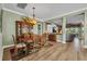 Formal dining room featuring a wood table, china cabinet, and elegant chandelier at 16021 Golden Lakes Dr, Wimauma, FL 33598