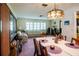 Open-concept dining and living area filled with natural light from plantation-style shutters at 1830 Oak Forest S Dr, Clearwater, FL 33759
