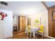 Bright dining room with wood floors, white brick accent wall and seating for four at 1830 Oak Forest S Dr, Clearwater, FL 33759