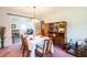 Bright dining space flows into a kitchen and living area, perfect for gatherings and entertaining at 1830 Oak Forest S Dr, Clearwater, FL 33759