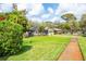 A well-maintained lawn and landscaping surround this single-Gathering home, offering curb appeal at 1830 Oak Forest S Dr, Clearwater, FL 33759