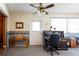 Dedicated office space featuring neutral tones and an attached chair and desk at 1830 Oak Forest S Dr, Clearwater, FL 33759