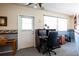 Office space with desk, chair, and outdoor access for convenience at 1830 Oak Forest S Dr, Clearwater, FL 33759