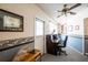 Office space with neutral tones, desk, chair and outdoor access at 1830 Oak Forest S Dr, Clearwater, FL 33759