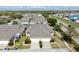 Aerial view of a neighborhood featuring well-maintained homes, green spaces, and roadways at 203 Oceania Ct, Apollo Beach, FL 33572
