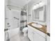 Traditional bathroom with tub, shower and vanity with granite countertop at 203 Oceania Ct, Apollo Beach, FL 33572