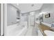 Large bathroom featuring double sinks, granite countertops and separate shower at 203 Oceania Ct, Apollo Beach, FL 33572