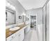 Spacious bathroom featuring double sinks, shower, soaker tub and granite countertops at 203 Oceania Ct, Apollo Beach, FL 33572