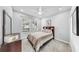 Cozy bedroom features a comfortable bed, neutral colors, and a ceiling fan at 203 Oceania Ct, Apollo Beach, FL 33572