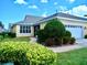 Charming single-story home with a well-maintained front yard and two-car garage at 203 Oceania Ct, Apollo Beach, FL 33572