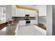 Modern kitchen features granite countertops, stainless steel appliances, and mosaic tile backsplash at 203 Oceania Ct, Apollo Beach, FL 33572