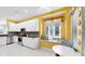Bright eat-in kitchen features white cabinetry, mosaic backsplash, stainless appliances, and a window seat at 203 Oceania Ct, Apollo Beach, FL 33572