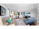 Open-concept living area with hardwood floors, seamlessly connecting the living room to the kitchen at 203 Oceania Ct, Apollo Beach, FL 33572