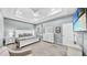 Spacious main bedroom featuring tray ceiling, television, and ample closet space at 203 Oceania Ct, Apollo Beach, FL 33572