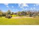 View of a playground in a community park with plenty of space for outdoor activities at 21662 Pristine Lake Blvd, Land O Lakes, FL 34637