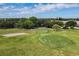 An aerial view of the golf course with sand traps and manicured green at 2226 Switzerland Way # 32, Clearwater, FL 33763