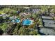 An aerial view showing the community pool, tennis courts, and clubhouse at 2442 Silvermoss Dr, Wesley Chapel, FL 33544