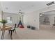 Spacious bedroom featuring neutral walls, ceiling fan, a cozy play area, and plenty of natural light at 2442 Silvermoss Dr, Wesley Chapel, FL 33544