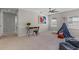 Spacious bedroom with carpet, study area and play tent at 2442 Silvermoss Dr, Wesley Chapel, FL 33544