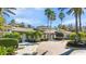 Exterior of a clubhouse showcasing architectural design and landscaping at 2442 Silvermoss Dr, Wesley Chapel, FL 33544