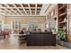 Expansive clubhouse features a modern ceiling design, cozy seating, a fireplace, and tables for gatherings at 2442 Silvermoss Dr, Wesley Chapel, FL 33544