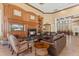 Relax in the clubhouse with a cozy fireplace, comfortable seating, and a large TV for entertainment at 2442 Silvermoss Dr, Wesley Chapel, FL 33544