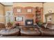 Inviting clubhouse lounge with a fireplace, TV, comfortable seating, and access to outdoor amenities at 2442 Silvermoss Dr, Wesley Chapel, FL 33544