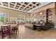 Spacious clubhouse offers a cozy fireplace, TV, comfortable seating, and dining tables for social gatherings at 2442 Silvermoss Dr, Wesley Chapel, FL 33544