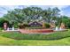 Community entrance sign surrounded by beautiful landscaping, fountains, and manicured greenery at 2442 Silvermoss Dr, Wesley Chapel, FL 33544