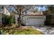 Charming two-story home showcasing a well-maintained lawn, a two car garage and inviting curb appeal at 2442 Silvermoss Dr, Wesley Chapel, FL 33544