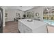 Kitchen island with dining area and view of the pool at 2442 Silvermoss Dr, Wesley Chapel, FL 33544