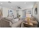 Spacious living room with hardwood floors leading to the staircase at 2442 Silvermoss Dr, Wesley Chapel, FL 33544