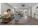 Spacious living room with wood flooring, neutral paint, and a ceiling fan at 2442 Silvermoss Dr, Wesley Chapel, FL 33544
