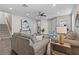 Open-concept living area with hardwood floors, ceiling fan, and neutral paint at 2442 Silvermoss Dr, Wesley Chapel, FL 33544