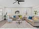 Inviting living room with hardwood floors, recessed lighting, and ceiling fan at 2442 Silvermoss Dr, Wesley Chapel, FL 33544
