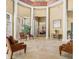 Bright lobby featuring soaring ceilings, elegant columns, and comfortable seating areas at 2442 Silvermoss Dr, Wesley Chapel, FL 33544