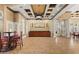 Clubhouse lobby boasts coffered ceilings and stylish furniture at 2442 Silvermoss Dr, Wesley Chapel, FL 33544