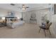 Bright main bedroom with a decorative ceiling, large windows, stylish furniture, and elegant decor at 2442 Silvermoss Dr, Wesley Chapel, FL 33544