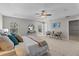 Bright main bedroom with a decorative ceiling, large windows, stylish furniture, and elegant decor at 2442 Silvermoss Dr, Wesley Chapel, FL 33544