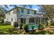 Back of home featuring an enclosed pool and screen, with a well manicured lawn area at 2442 Silvermoss Dr, Wesley Chapel, FL 33544