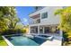 A backyard with a pristine pool and an outdoor kitchen perfect for relaxation at 2519 N Riverside Dr, Tampa, FL 33602