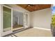 Balcony with ceiling fan, tile floors and view into a room with french doors and stairs at 2519 N Riverside Dr, Tampa, FL 33602