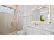 Modern bathroom featuring a glass shower and vanity with a backlit LED mirror at 2519 N Riverside Dr, Tampa, FL 33602