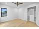 Bright bedroom featuring modern ceiling fan, hardwood floors, closet, and modern windows at 2519 N Riverside Dr, Tampa, FL 33602