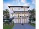 Two-story home with a two-car garage, balcony, front yard with landscaping, and a charming staircase on the left side at 2519 N Riverside Dr, Tampa, FL 33602