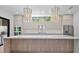 Gourmet kitchen boasts a large island, marble backsplash, and stainless steel appliances at 2519 N Riverside Dr, Tampa, FL 33602