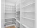A walk-in pantry with shelving and hanging basket storage solutions at 2519 N Riverside Dr, Tampa, FL 33602