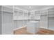 Spacious walk-in closet with custom shelving and island storage at 2519 N Riverside Dr, Tampa, FL 33602